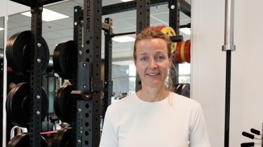 Portræt af Mille, patient hos Aleris Fysioterapi.